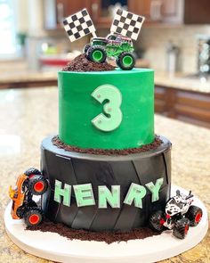 a birthday cake made to look like a monster truck with dirt on top and number 3