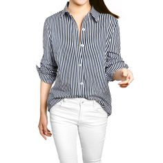 Clean stripes lend a graphic touch to this button-down shirt. A trendy high-low hem and roll-up sleeves for added laid-back appeal. Wear this on the weekend running errands or Sunday brunch. Pair it perfectly with your favorite trousers and heels for an instant charming outfit. Amp up your ensemble with this striped shirt. College Wardrobe, Spring Capsule Wardrobe, Striped Sleeve, Turndown Collar, Roll Up Sleeves, Clothing Essentials, Collar Shirt, Vertical Stripes, High Low Hem