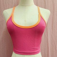 Shein Ezwearcontrast Binding Criss Cross Back Rib-Knit Crop Cami Top New With Out Tags. Color: Pink/ Orange Size: X-Small Stretch Tops With Contrast Color, Trendy Pink Tops With Splicing, Stretch Sleeveless Top With Contrast Color, Sleeveless Stretch Top With Contrast Color, Color Block Stretch Sleeveless Top, Pink Ribbed Racerback Top, Pink Casual Tops With Contrast Color, Fitted Color Block Pink Top, Fitted Pink Color Block Top