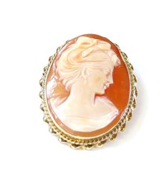 "14K Yellow Gold Cameo Brooch / Pendant Lady Portrait Pin and Pendant Carved Shell Caramel color background No scratches or cracks to note Measures approx: 1-1/4\" tall X 1\" Wide or 3.4 cm x 2.7 cm - with frame Cameo measures: 1-1/4\" X 7/8\" or 3 cm X 2.2 cm Fastens with Safety clasp or rollover clasp in good working condition Total Weight 7.4 Grams 110916-4320 gemsoft 02006 FEEL FREE TO MESSAGE ME IF YOU HAVE ANY QUESTIONS OR WISH TO SEE MORE PICTURES * Back to Shop Watch and Wares? https://w Oval Brooches For Formal Occasions, Classic Oval Brooches, Collectible Cabochon Brooches, Oval Cabochon Brooches For Anniversary, Classic Oval Cameo Brooch, Collectible Oval Cameo Brooch, Oval Cameo Brooch For Anniversary, Collectible Oval Cameo Brooches, Classic Oval Brooches For Collectors