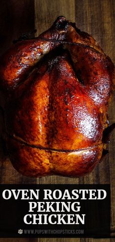 an oven roasted chicken on a wooden table with the words oven roasted peking chicken over it