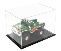 a toy truck in a glass case on a white background