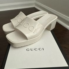 White Gucci Rubber Sandals. Never Worn. Excellent Condition. Luxury White Heels For Beach, Luxury White Beach Heels, Modern Gucci Sandals For Summer, Chic Gucci Sandals For Summer, Chic Gucci Sandals For Spring, Gucci Sandals With Branded Heel Counter For Beach, Gucci Summer Sandals With Padded Heel, Gucci Block Heel Summer Heels, Chic Gucci Sandals With Block Heel