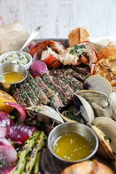 there is a platter with seafood and bread on it