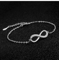 ♥ MATERIAL: 925 sterling silver and cubic zirconia. 925 Sterling Silver is the ideal metal material for making accessories thanks to its proven shine, brightness and strength. ♥ size: bracelet length: 15cm + 4cm (extension), infinity size: 2*1cm, weight: 1.8g. ♥ Infinity Design: Infinity symbol silver bracelet, simple and elegant design. Infinity means infinite love and friendship forever. It is an ideal gift for your good friend, lover or yourself. ♥ Packaging: Packed in a filigree gift box, it Elegant Silver Bangle Charm Bracelet, Silver Crystal Diamond Bracelet As Gift, Sterling Silver Bracelet With Sparkling Stones In Diamond White, Formal Silver Crystal Chain Bracelet, Elegant Silver Chain Charm Bracelet For Formal Occasions, Elegant Silver Crystal Bracelets, Silver Crystal Tennis Bracelet As Gift, Elegant Sterling Silver Crystal Bracelet As Gift, Silver Crystal Bracelet With Adjustable Chain