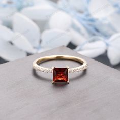 Red 14k Gold Birthstone Ring For Promise, Red 14k Gold Wedding Ring With Brilliant Cut, Red Birthstone Ring In 14k Gold For Anniversary, Red 14k Gold Birthstone Ring For Anniversary, 14k Gold Red Brilliant Cut Wedding Ring, Red 14k Gold Brilliant Cut Wedding Ring, Red Princess Cut Ring With Prong Setting, Red Princess Cut Anniversary Ring, Red Birthstone Ring In 14k Gold For Weddings