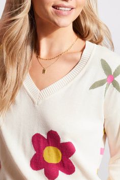 This darling lightweight sweater is a delightful choice for cool spring mornings and evenings. This V-neck features a charming floral design on the front, while the back boasts trendy colorful stripes. With its pop-over style and three-quarter sleeves, it’s both comfortable and stylish. Color- Sand dust multi; fuchsia pink, bright pink, coral, cream, lime and forest green. Floral design on front. Stripes on the back. Pull-over design. Fabric- 60% Cotton. 40% Viscose. Care- Hand wash cold water s Chic V-neck Sweater For Spring Layering, Spring V-neck Sweater For Layering, Chic Spring Sweater For Daywear, Chic Spring Daywear Sweater, Spring Sweater For Layering, Chic Knit V-neck Sweater For Spring, Knit Tops For Spring Daywear, V-neck Sweater With Floral Print For Fall, Winter Floral Print V-neck Top