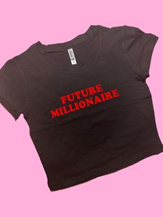 Future Millionaire SNUG FIT Crop Top | Cute Crop Top | Graphic Top | Gift For Her | Y2K Baby Tee | Y2K crop top | Gift for friend | Comfy Top to Lounge in! Actual item may be lighter/darker than pictured. M A T E R I A L S - SNUG FIT - 100% RING SPUN COTTON - Shoulder Taping S I Z I N G - Size chart is available on our listing photos. S H I P P I N G  &  P R O D U C T I O N  T I M E - Production Time is 5 Business Days. (May be delayed during the Holiday Season) - Shipping Time is 2-6 Business D Fitted Crew Neck Crop Top With Text Print, Cropped Cotton T-shirt With Logo Print, Trendy Cropped Shirt With Logo Print, Trendy Cropped Crew Neck Shirt With Logo, Cotton Cropped T-shirt With Logo Print, Trendy Cropped Shirt With Logo Print And Crew Neck, Fitted Logo Print Cropped T-shirt For Summer, Logo Print Cropped T-shirt For Streetwear, Fitted Slogan Crop Top For Summer