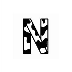 the letter n is made up of black and white camo print, with an arrow