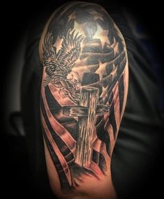 a cross with an eagle and american flag on it