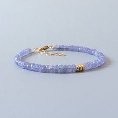 Fall in love with our dainty tanzanite gemstone beaded bracelet, perfect timeless delicate minimalist design, designed to be stacked or worn on its own. Will make a thoughtful birthday, christmas. anniversary gift for your wife, mother, sister, daughter, or friend. Tanzanite is December's birthstone. Your purchase will arrive elegantly packed  in a gift-ready suede storage bag  and will include a complimentary cleaning cloth. Treat yourself or your loved ones with this high-quality handmade jewe Tanzanite Bracelet, Birthday Mom, Jewelry Minimalist, Tanzanite Gemstone, Bracelet Gemstone, Purple Crystal, Gemstone Beaded Bracelets, Birthstone Gifts, December Birthstone