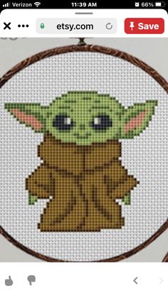 the baby yoda cross stitch pattern is shown on an iphone screen, and it looks like