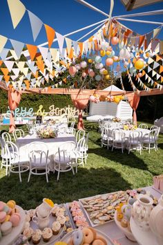 an outdoor party with lots of food and decorations