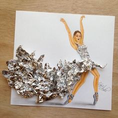 a card with a drawing of a woman in a silver dress and shoes on it