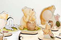 several cutouts of winnie the pooh and other cartoon characters are shown in front of a white background