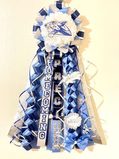 this is an image of a football fan's cheerleader ribbon ornament