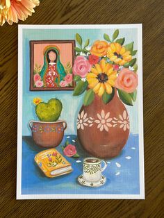 a painting of flowers in a vase next to a potted cactus and other items