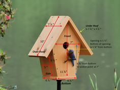 a bird house with measurements for the height