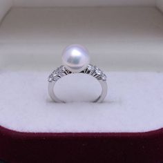 9-10mm Freshwater Pearl Ring This popular ring design features AAAA quality, round freshwater pearls measuring 9-10mm. Material: Freshwater Pearl with 925 sterling silver, cubic zirconia Product Information Pearl Type Freshwater Pearl Edison Origin China Shape Round Quality AAAA Size 9-10mm Nacre Very Thick Color Purple /White Luster Very High Popular Rings, Freshwater Pearl Ring, Gift Product, Pearl Types, Cz Ring, Elegant Ring, Product Introduction, Pearl Color, Pearl Size