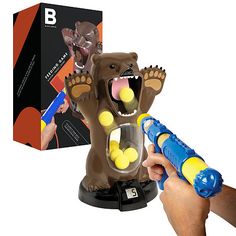 Perfect your marksmanship with Black Series Feed the Bear Target Game. Just squeeze the custom pump-action launcher to fire 8 indoor-safe foam balls from up to 20 feet away! Strike the bear's levered tongue to score points, and watch the balls collect inside the bear's transparent belly! The LCD display tracks points automatically for group or solo play! Designed to be played inside or outside with the whole family! Get everyone off their feet and away from electronics for hours of endless fun. Bears Game, Games Table, Discovery Kids, Boy Toys, High Tech Gadgets, Indoor Games, Valentines Day Gifts For Him, Black Series, All Toys