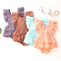 Dress Up Your Little Princess In This Adorable Summer Infant Baby Girls Bodysuits Clothes Princess Ruffle Cotton For 6-24 M. The Floral Pattern And Ruffle Accents Add A Touch Of Charm To The Overall Dress. The Square Neckline And Cotton Material Provide Comfort For Your Baby Girl, Making It Suitable For Both Casual And Formal Occasions. This Dress Is Perfect For Summer And Can Be Worn By Girls Aged 6-9 Months. The Short Dress Length And Blended Fabric Type Make It A Versatile Addition To Your Ba Cute Solid Color Bodysuit For Playwear, Cute Solid Color Playwear Bodysuit, Cute Solid Color Bubble Romper For Beach, Cute Solid Color Beach Bubble Romper, Cute Bodysuit For Summer, Cute Solid Color Bodysuit For Summer, Sleeveless Ruffled Bodysuit For Playtime, Sleeveless Ruffles Bodysuit For Playtime, Cute Solid Color Summer Bodysuit