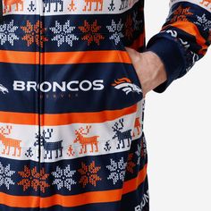 These Denver Broncos Ugly Short One Piece Pajamas will keep you bundled up and oh, so comfortable while making sure your legs don't overheat. Balanced, as all things should be. Features Onesie with zipper closure to keep you comfy while you cheer on the team All-over team-colored design so you can rep the team in style Team logo displays throughout, in case there were any doubts where your allegiances lie Repeat winter-themed pattern throughout that will have you feeling like you're in a winter White Relaxed Fit Winter Sleepwear, Winter White Onesie For Loungewear, White Winter Onesie For Loungewear, Casual Christmas Loungewear Onesie, White Winter Loungewear Onesie, Short One Piece, Short Pant, Long Sleeve And Shorts, One Piece Pajamas