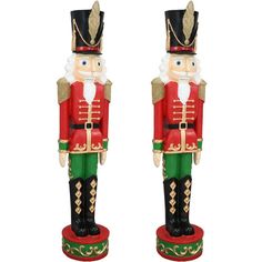 two wooden nutcrackers standing next to each other