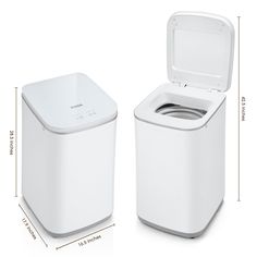 a white trash can with the lid open next to an automatic washer and paper towel dispenser