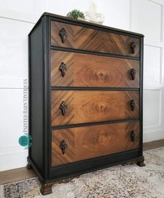 an old dresser with some knobs on it's drawers and wood grain inlaying