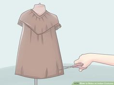 a person is trying to tie a dress on a mannequin