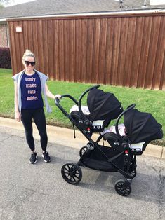 a woman standing next to a baby stroller