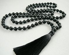 Black Mala Necklace 108 Mala Bead Necklace for Man Women Gift Matte Black Onyx Mala Beaded Necklace Hand Knotted Black Tassel Long Necklace - 8mm Matte Black Onyx 108 beads - 10 mm Black Onyx Guru bead - 9cm Black tassel MY SHOP: https://www.etsy.com/shop/BonBonStones Please contact me with any questions. I'm happy to help! Black Hand-strung Beads As Gift, Elegant Polished Beads For Meditation, Black Hand-strung Beads Gift, Gift Hand-strung Black Beads, Onyx Necklace With Black Beads For Meditation, Spiritual Black Onyx Beaded Necklace, Black Spiritual Beaded Necklaces With Polished Beads, Black Gemstone Beads Necklace For Meditation, Adjustable Black Beaded Necklace With Gemstone Beads