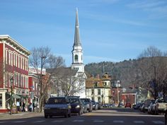 a church steeple towering over a small town