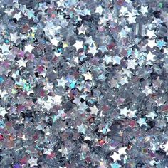 an image of many stars in the sky that is very colorful and glittery,