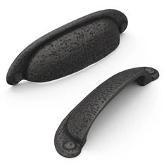 two black door handles are shown on a white background and one is in the shape of an oval