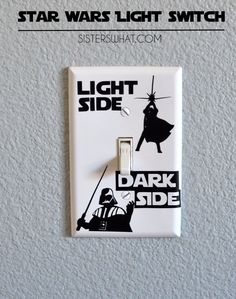 a light switch with the words dark side on it and an image of darth vader