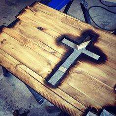 a wooden cross sitting on top of a table