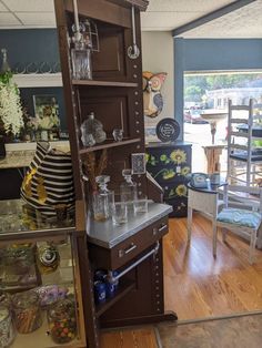 the inside of a store with glassware on display