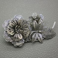 An amazing vintage silver filigree brooch, with oxidized black finish. This large flower design brooch is an authentic piece of handcrafted Yogyakarta silver jewelry, made in 1950's in traditional Javanese yogya (djokja) filigree technique. The brooch will be shipped in a gift box. The brooch measures 2 3/4" long by 1 3/5" wide (6.9 cm x 4.1 cm) Weight: 13.2 grams The brooch is marked for 800 silver, also marked with maker's initials. C - clasp closure Excellent vintage condition, with lovely pa Filigree Jewelry, Silver Filigree, Large Flowers, Flower Brooch, Vintage Silver, Flower Designs, Brooches, Netherlands, Patina