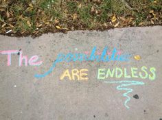 the sidewalk has chalk writing on it that says, the possibilities are endlessly possible