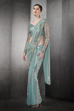 Aqua pre-draped saree in tulle base with linear metallic beaded embroidery.
Component: 1
Pattern: Embroidered
Type Of Work: Striped Pattern
Fabric: Tulle
Color: Blue
Other Details: 
Pre-draped saree
Note: The blouse worn by the model is not for sale
Occasion: Cocktail, Bride - Aza Fashions Festive Gala Pre-draped Saree, Festive Embellished Pre-draped Saree For Gala, Festive Pre-draped Saree With Sequins, Pre-draped Lehenga With Sheer Dupatta For Party, Pre-draped Lehenga For Party With Sheer Dupatta, Embellished Pre-draped Saree For Gala In Traditional Drape, Embellished Pre-draped Saree For Gala, Fitted Pre-draped Saree For Gala Festivities, Party Embellished Draped Dupatta