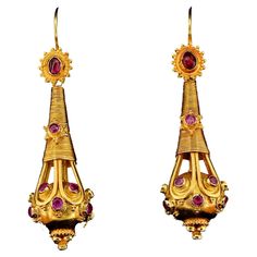 Journey to the Past A spectacular pair of 19th Century Etruscan Revival earrings, 1860 ca They boast the magnificent workmanship of the era, solid 18 KT gold substantial weight of 15.8 grams – so not much delicate to wear as can be the more common light in weight Many nineteenth-century jewelers, the most famous being the House of Castellani, were inspired to create their own versions of these ancient pieces, hence "Etruscan Revival.” This stunning pair is highly decorated with wired gold treads Antique Earrings With Historical Design For Ceremonial Occasions, Traditional Yellow Gold Earrings With Historical Design, Ornate Historical Design Earrings, Antique Earrings With 17 Jewels For Ceremonial Occasions, Traditional Earrings With Historical Design For Wedding, Traditional Historical Design Earrings For Wedding, Traditional Wedding Earrings With Historical Design, Antique Earrings For Ceremonial Festivals, Antique Style Ceremonial Earrings For Festivals