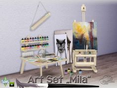 an artist's studio with art supplies and paintings