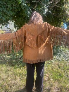 AMAZING vintage suede fringe jacket with beads. Guessing from the 70's. It's in great shape with some color transfer . Lined inside. No tag. Awesome leather buttons. Very heavy!! Fits a small 4/6 best. Size 8 would fit, but won't button .  Bust- 17" Length (including fringe) - 31" Arm length from shoulder - 24" Winter Festival Outerwear With Beaded Fringe, Bohemian Winter Outerwear With Beaded Fringe, Bohemian Festival Outerwear With Beaded Fringe, Long Sleeve Beaded Fringe Festival Outerwear, Vintage Fringed Winter Outerwear, Vintage Winter Outerwear With Fringe, Vintage Fringe Outerwear For Winter, Winter Outerwear With Beaded Fringe And Long Sleeves, Hippie Look 70s