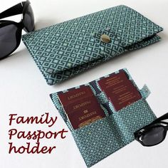 the family passport holder is made out of fabric and has sunglasses on top of it