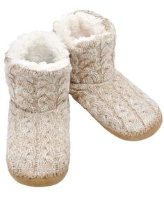 a pair of knitted slippers with white fur on the bottom and soles