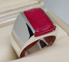 Rare 12 Carat Ruby Sterling Silver 925 Handmade Ring Elegant Red Ruby Ring, Men Ruby Ring Item: Handmade Ring Stone: Ruby Color of Stone: Red This is 100 Percent Hand Crafted Ring with Amazing Ruby Gemstone. Our Ring come with very beautiful Handmade Wooden Box. Shipping Service:  We use FedEx International and UPS for parcel delivery.  You will get tracking number in 3 to 5 business days after you place order Return Policy: We Accept return within 30 days. Buyer is responsible for Return Shippi Red Rectangular Ring With Polished Finish, Red Rectangular Rings With Polished Finish, Rectangular Red Rings With Polished Finish, Modern Hallmarked Red Rings, Modern Red Ruby Ring In Sterling Silver, Rectangular Hallmarked Ruby Ring, Rectangular Red Signet Ring For Gift, Red Rectangular Signet Ring For Gift, Ruby Ring Men