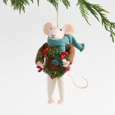 a mouse ornament hanging from a christmas tree