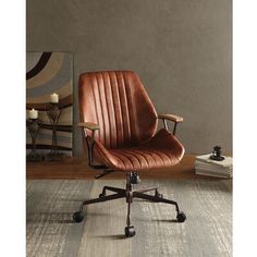 a brown office chair sitting on top of a wooden floor