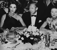 a group of people sitting at a dinner table